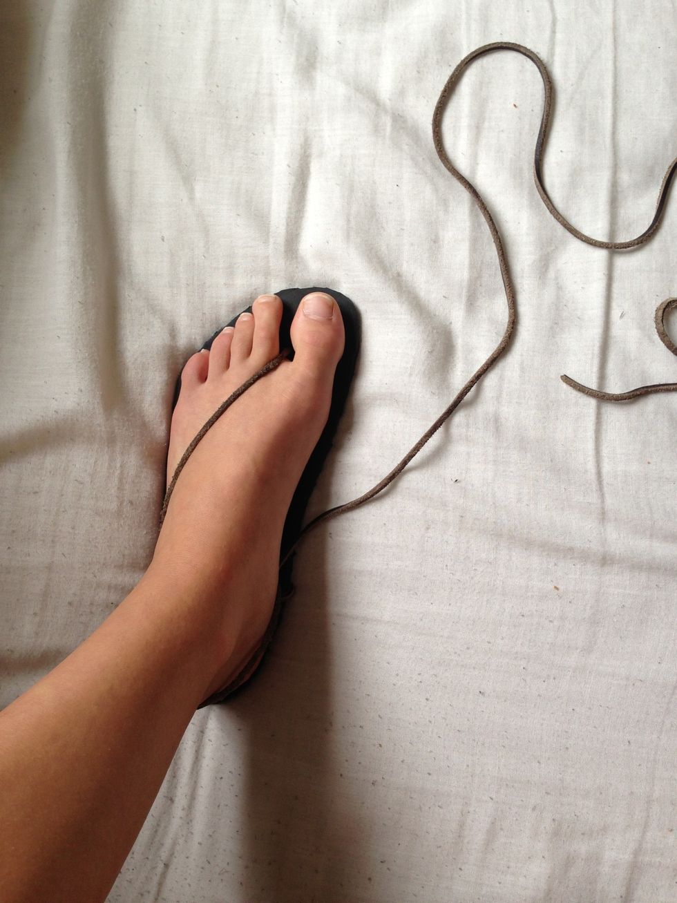 Slip in your foot into the sandal.