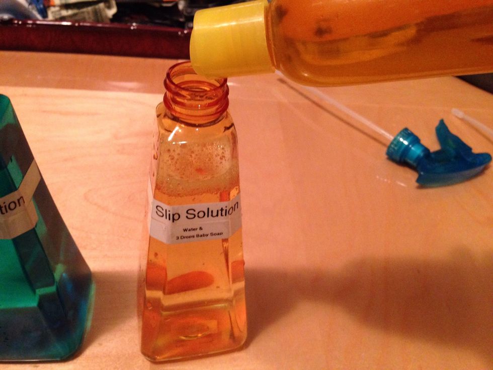Slip solution is filled with water all the way and add 2 or 3 drops of baby shampoo.