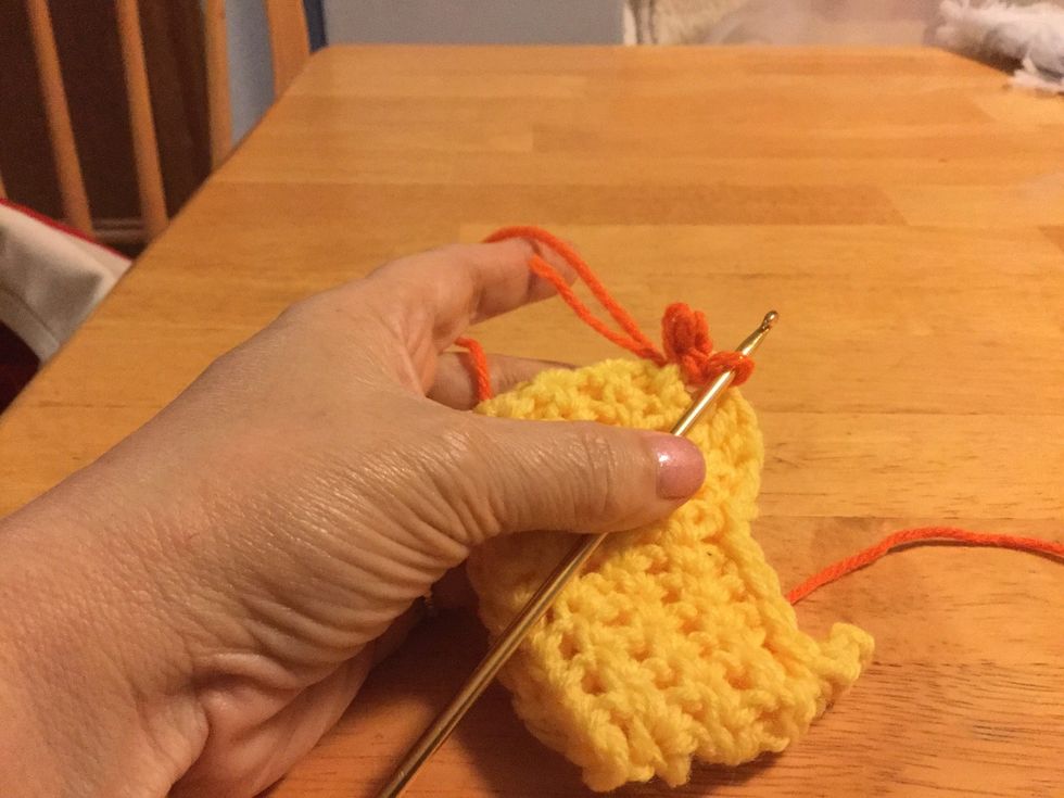 Slip stitch making sure that stitch goes over the HDC post.