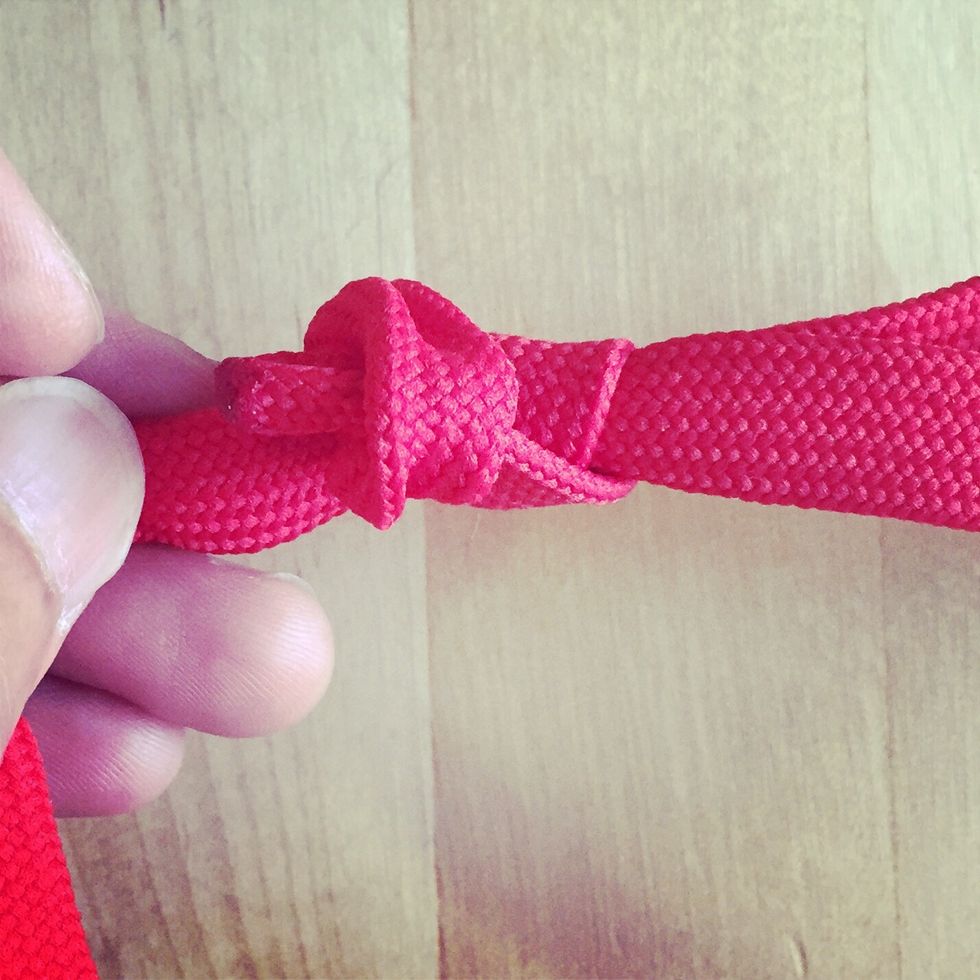 Slip the end into the loop and tighten knot. Repeat steps 7 to 9 to the other end.