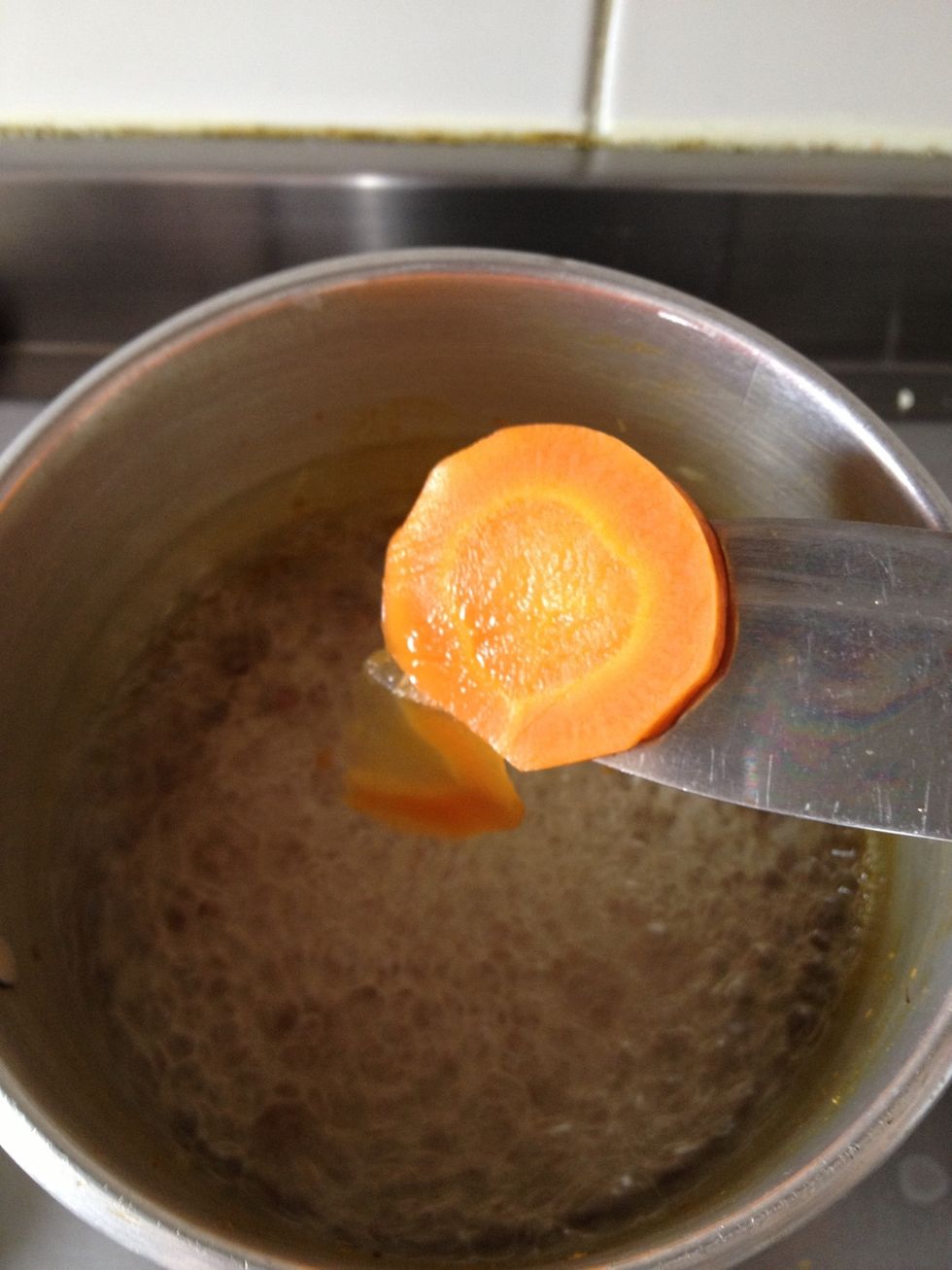 Slise your carrots and put them to boil for about  10 minutes