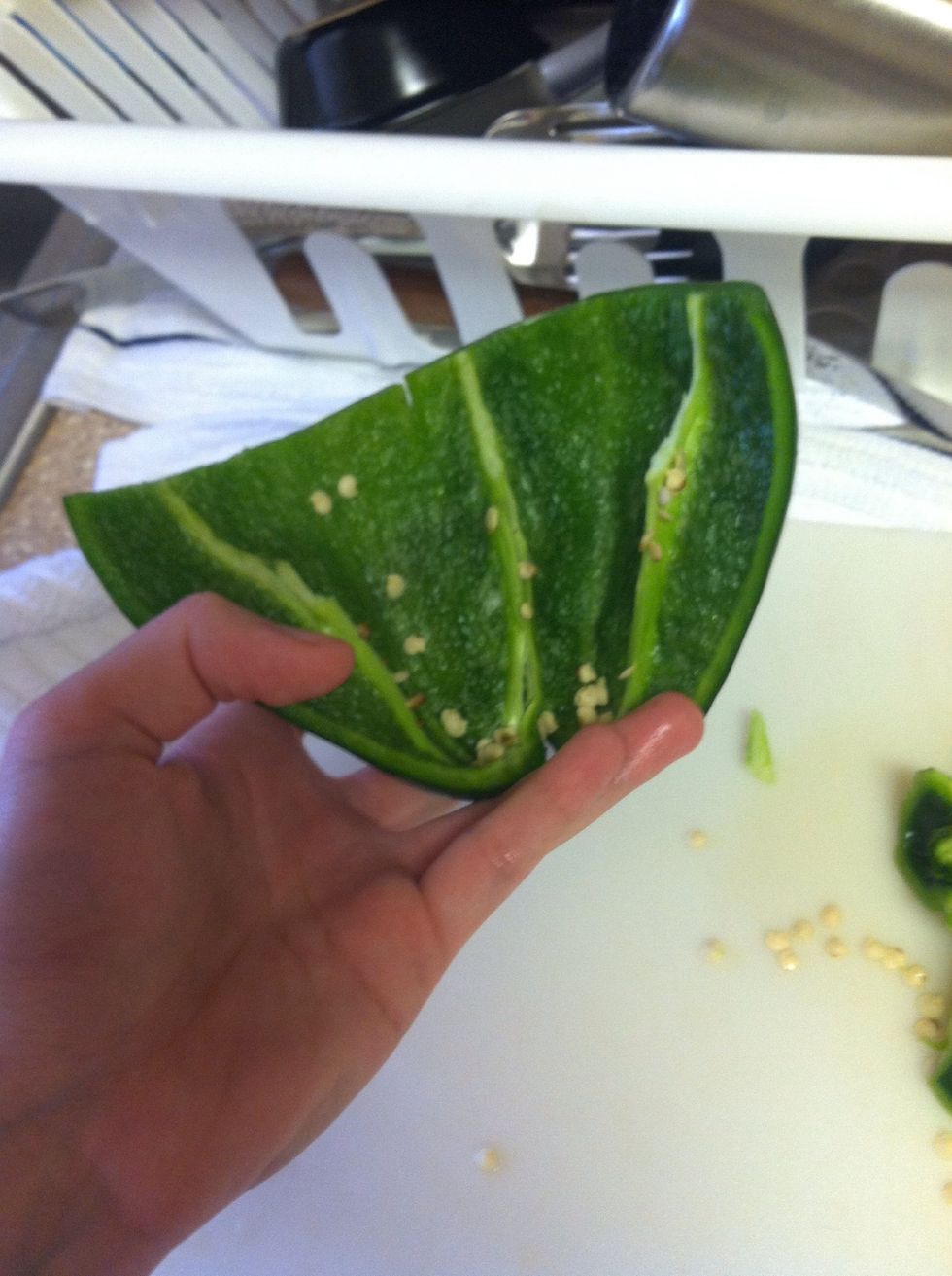 Slit in half then divid in threes making sure all seeds are gone