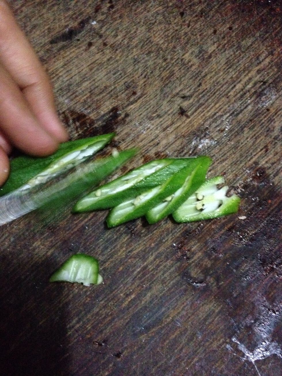 Slit the bhindi (okra) as shown in the picture