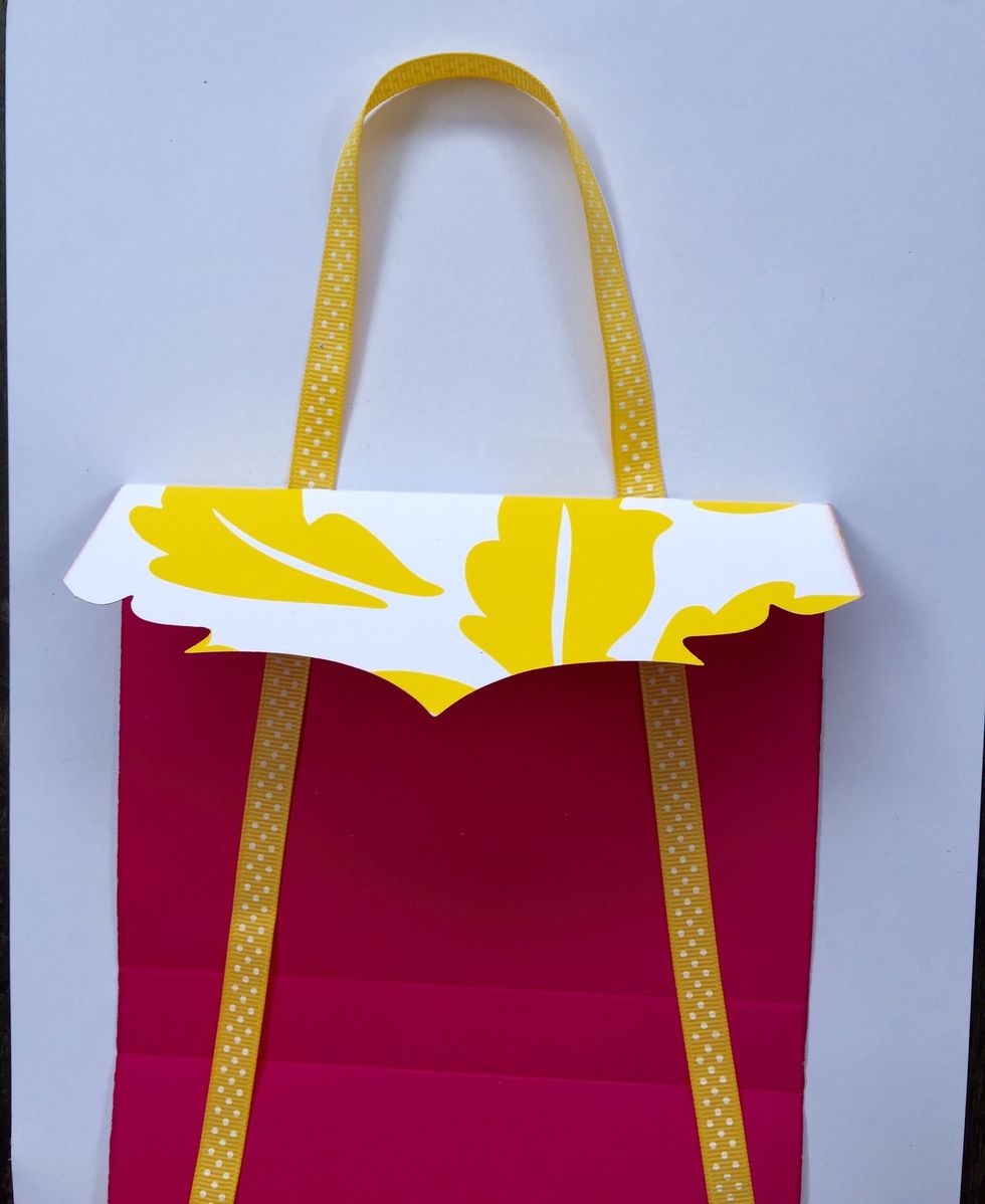 Slit the ribbon through depending on how long you want the handle to be.