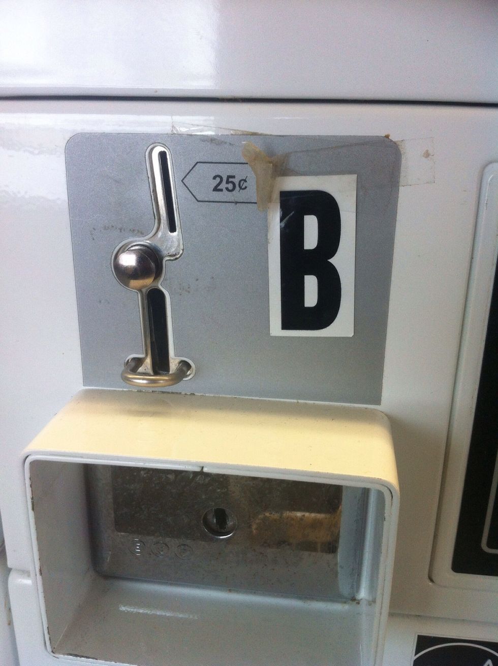 Slot for $.25 cents. The first part is where the coins goes and the second slot is where the coin comes out. When u insert the coin u should hear the coin drop sound.