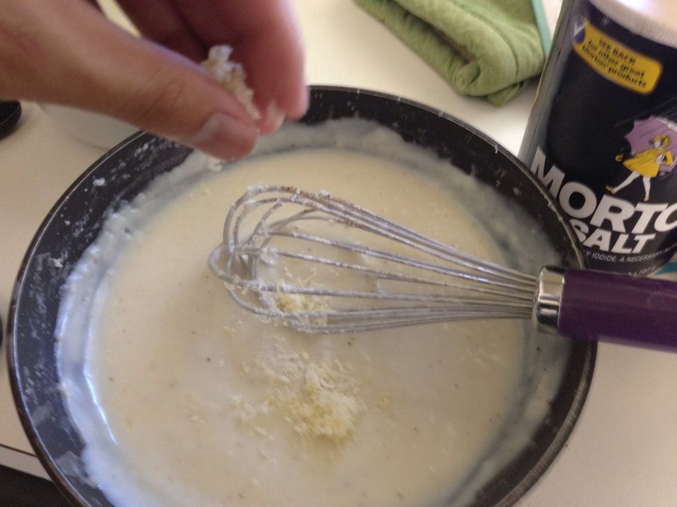 Slowly add cheese and stir