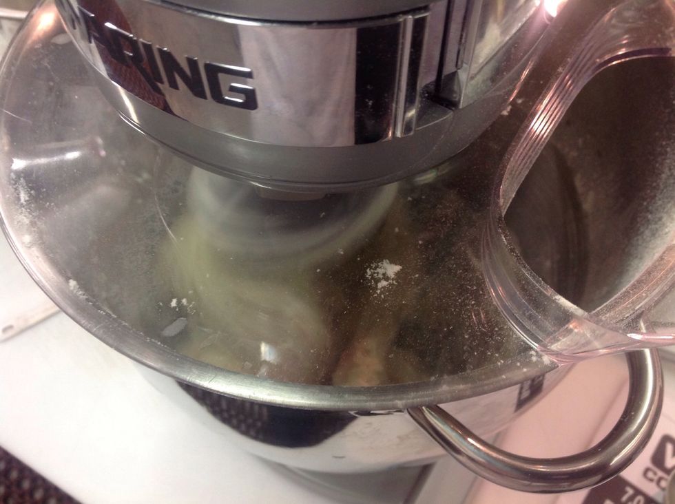 Slowly add flour to water/yeast/salt/sugar mixture using the dough hook on your mixer at a slow speed. Once all the flour is added, increase the speed to medium and knead for 5 minutes.