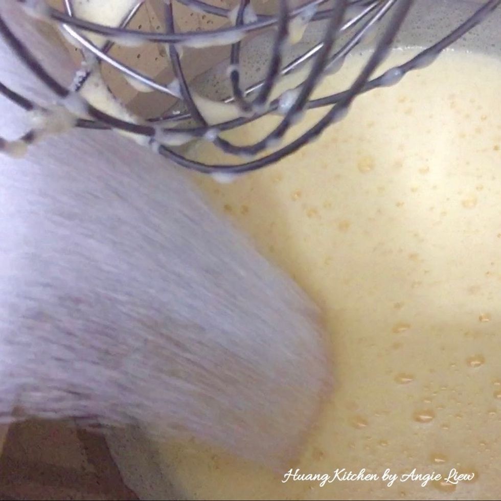 Slowly add in sugar.