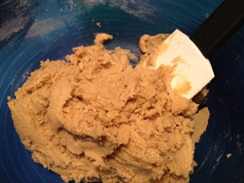 Slowly add in the flour, mixing through until the mixture thickens to become more like dough. (Round about now I take my first taste of the dough...it's hard to stop!!)