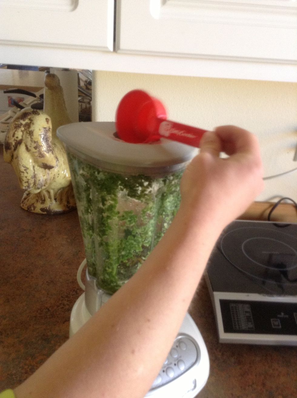 Slowly add olive oil to blender.