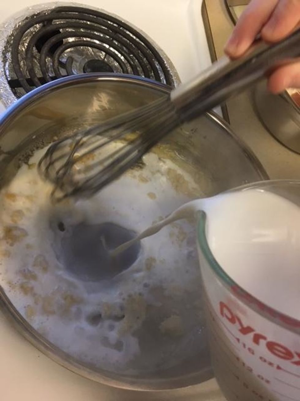 Slowly add the milk while whisking the flour-butter mixture. The mixture should then thicken.