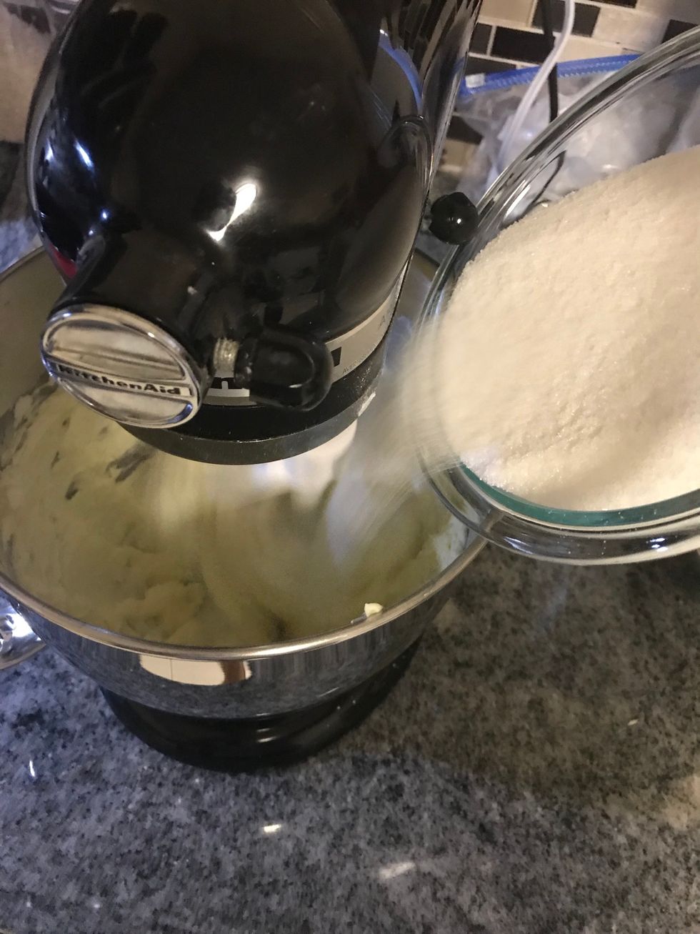 Slowly add the sugar.