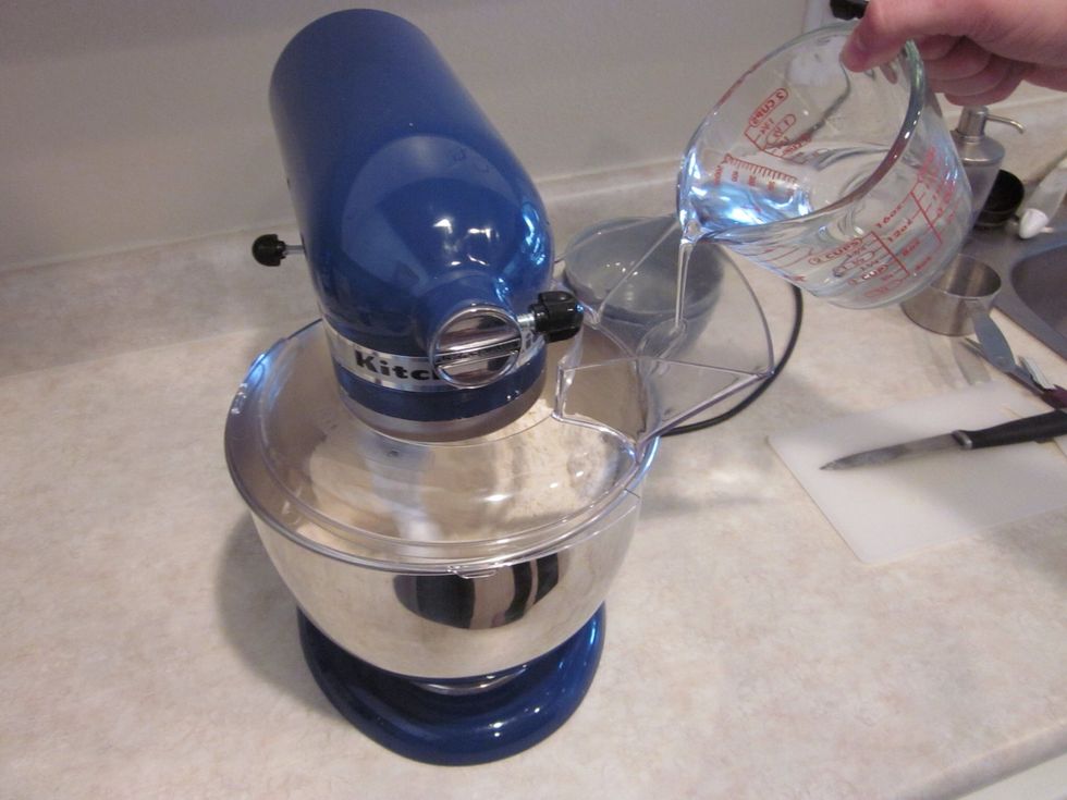 Slowly add the water and let the flour absorb everything. It will start to make a nice ball of dough
