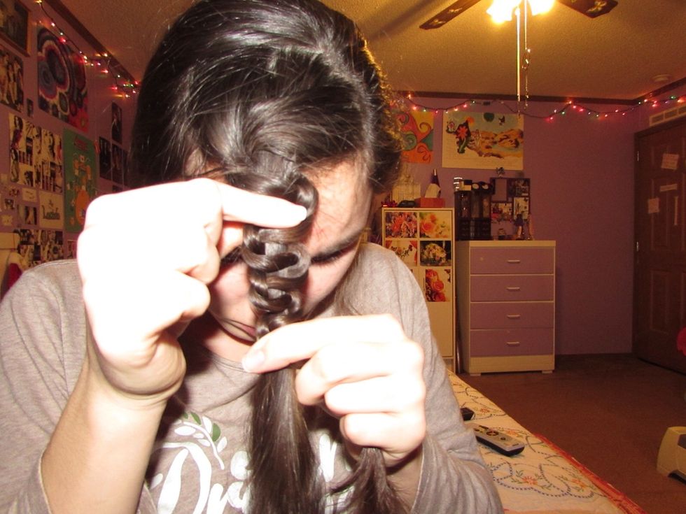 Slowly and carefully push and space out the braid. (This braid is also referred to as the Snake Braid) \ud83d\udc0d