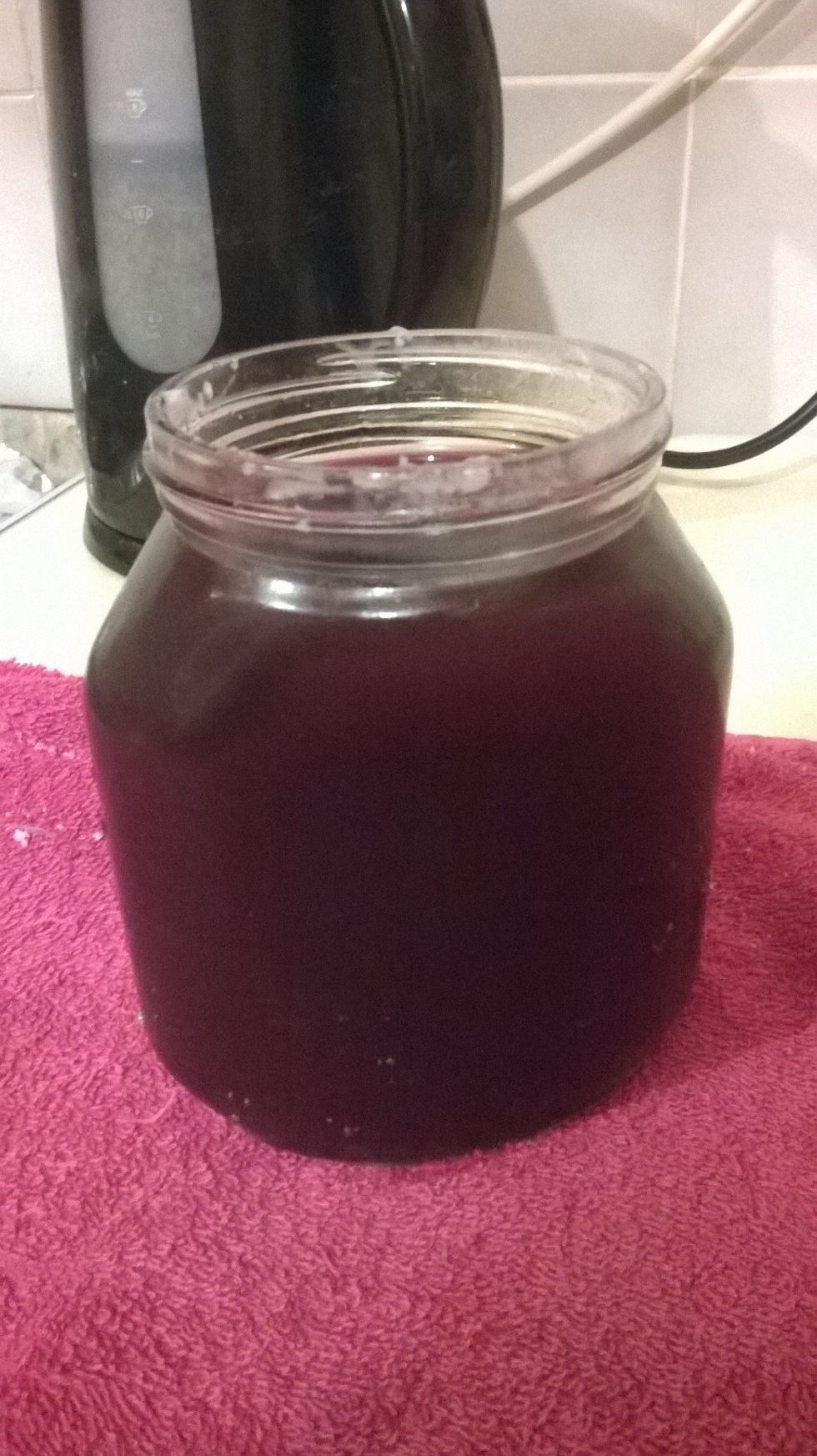 SLOWLY AND CAREFULLY take the jar out of the pot with oven mitts/towel - even get an adult if you need to. Any unwanted excess wax that is on the jar can be easily removed afterwards.