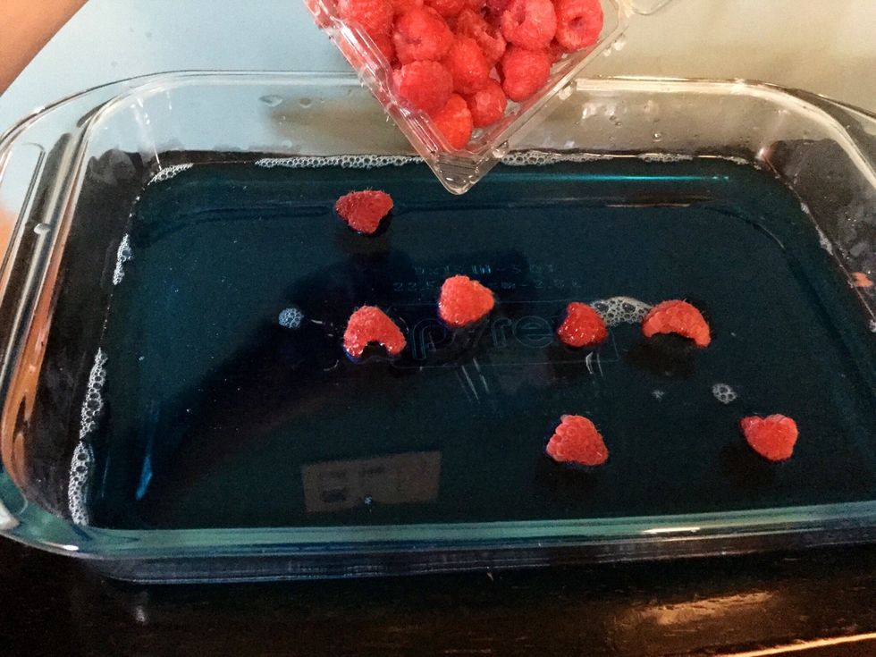 Slowly and gently pour your fresh fruit into the glass with your liquid jello