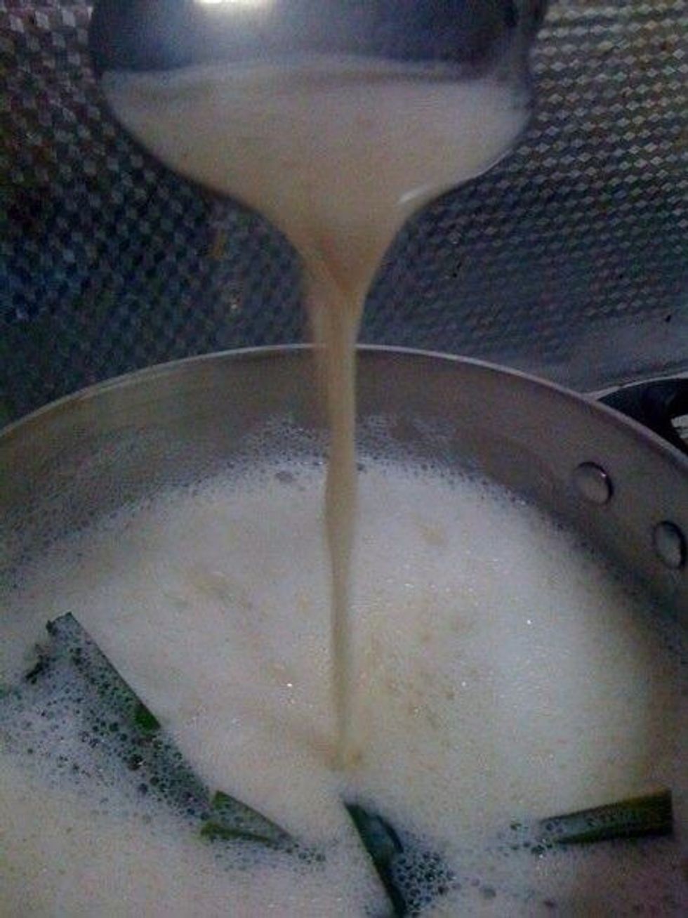 Slowly bring to a boil stirring constantly to avoid having the mixture boil over. Knot 2 pandan leaves (Screwpine leaves) and boil with mixture. Alternatively, you can substitute with vanilla essence