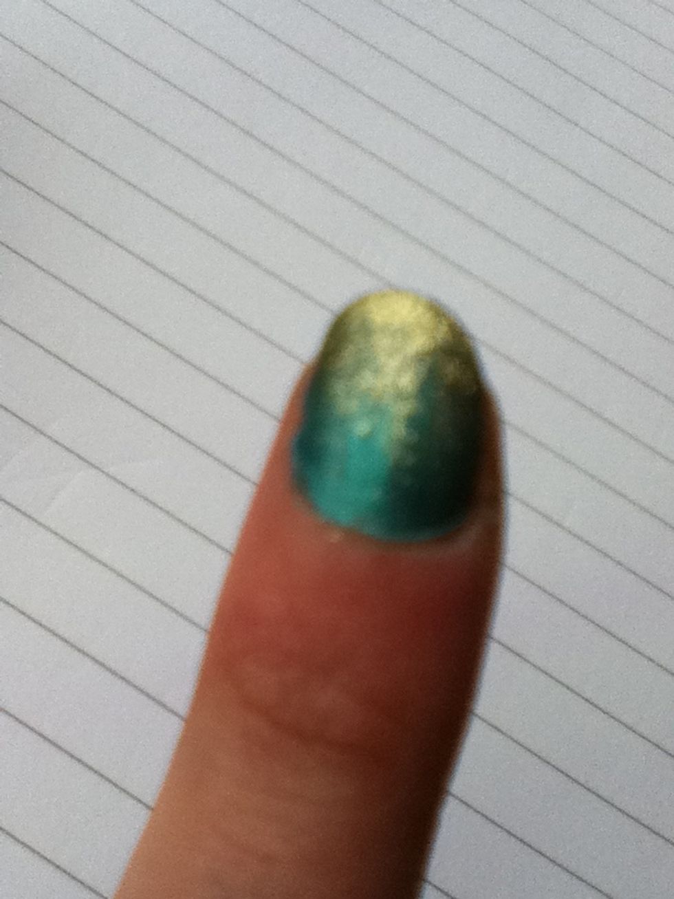 Slowly build up layers of the glitter, dabbing more at the end so it is solid glitter and dabbing less around the middle, to create a gradient look.