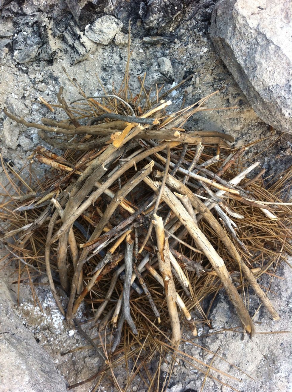 slowly, build your mini pyre. leaving the center open will allow oxygen to flow through and will get this pyre blazing. oxygen is a key ingredient in this recipe for heat and light.