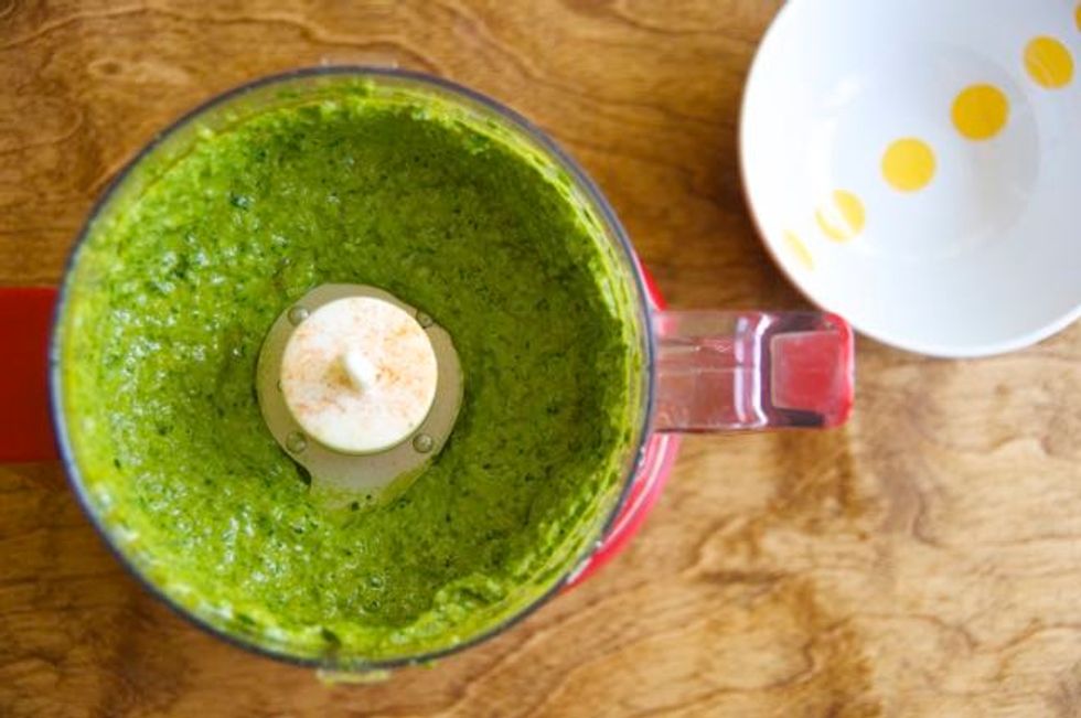 Slowly drizzle the olive oil into the processor while pulsing the mixture. And... Viola! Roasted jalape\u00f1o and cilantro pesto!