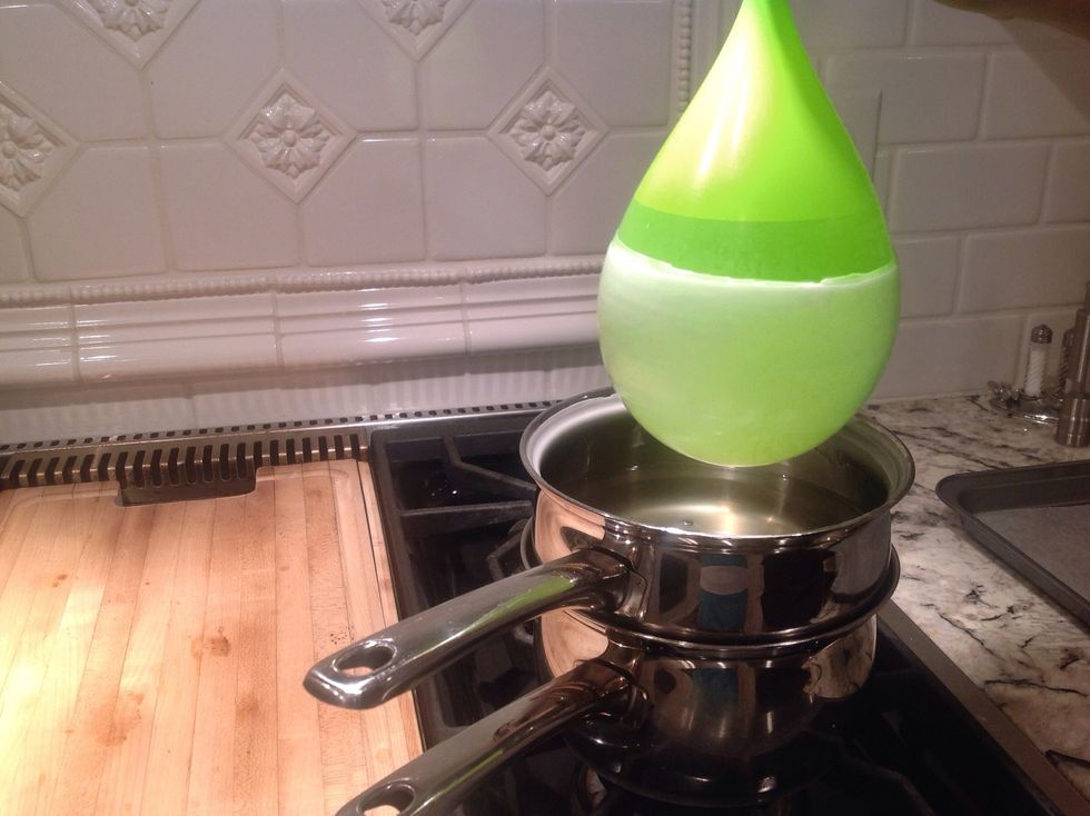 Slowly lift the balloon out of the wax. You should repeat steps five and six a few times, leaving a couple seconds in between each dip for the wax to cool.