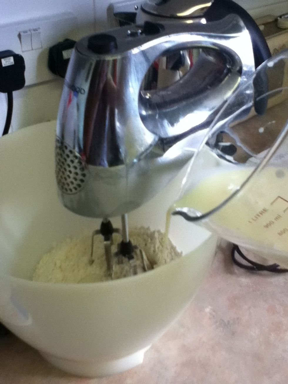 Slowly pour and whisk the mixture. Add optional berries