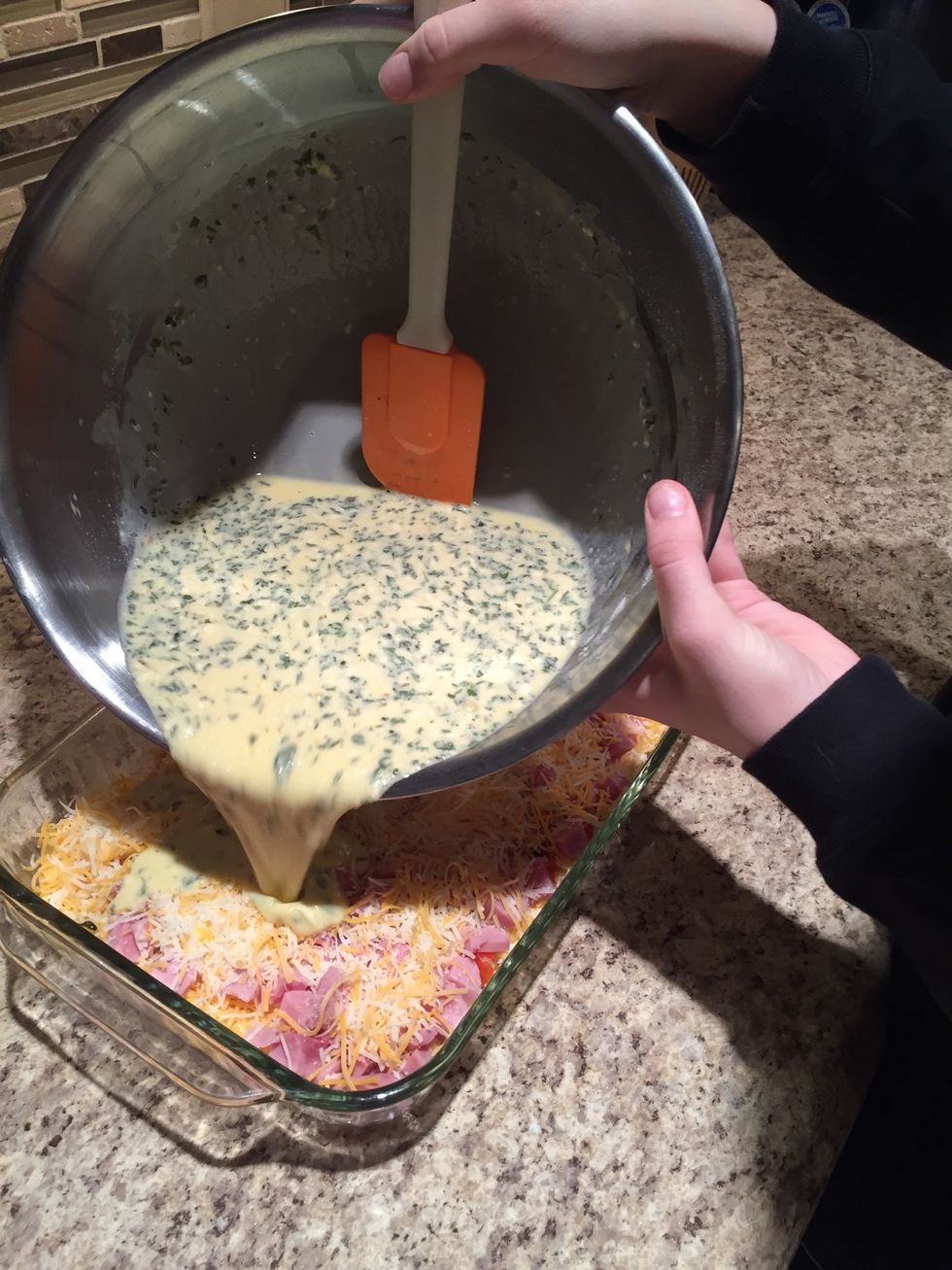 Slowly pour egg mixture into baking dish