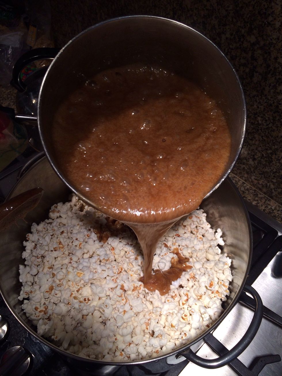 Slowly pour onto popcorn. I did this in batches so it's easier to stir and keep track of consistency.