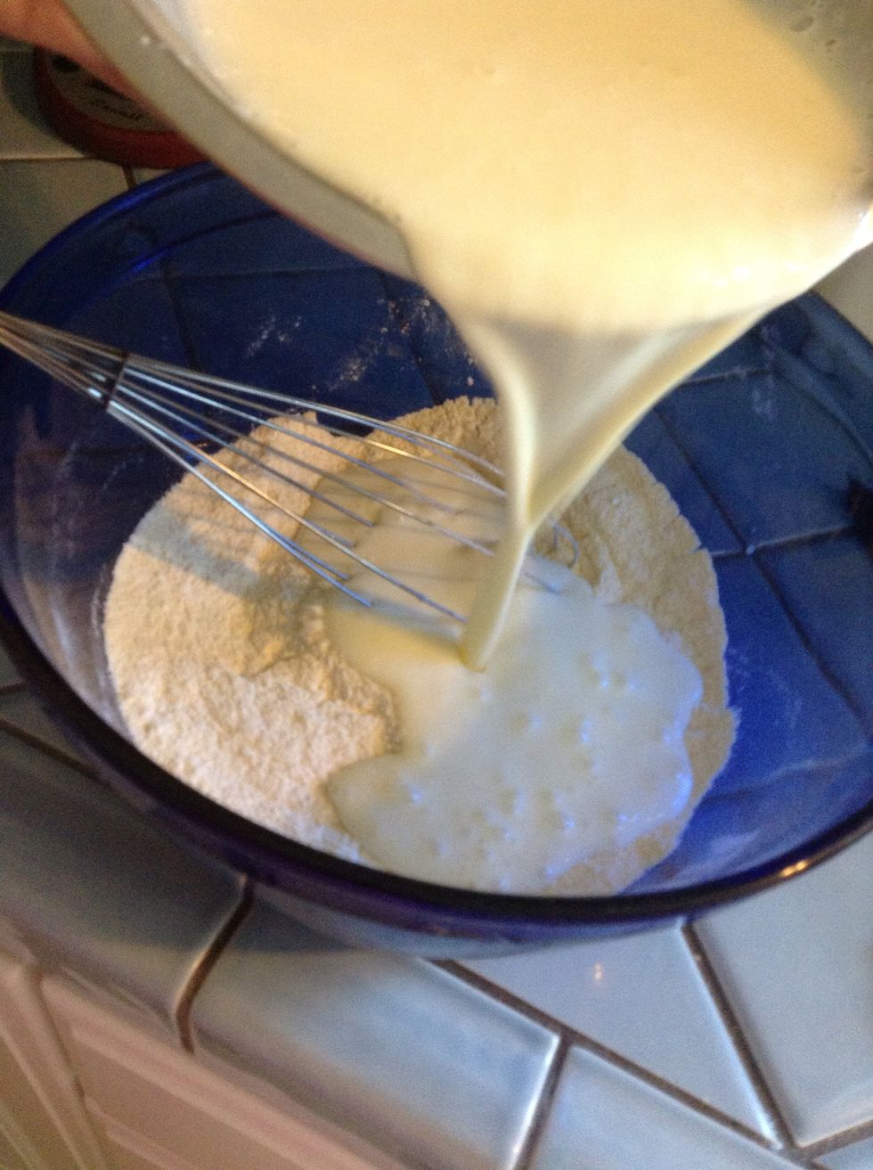 . . .slowly pour the buttermilk mixture into the dry ingredients, stirring until just incorporated. Too much stirring will toughen the dough!