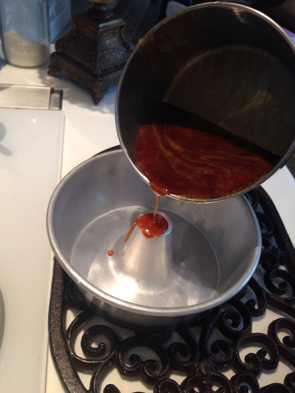 Slowly pour the sugar on the middle of the bundt form pan and allow to simmer down. Make sure the edges of the pan have a thin layer.