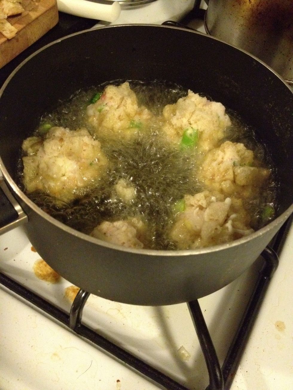 Slowly put in the ball and then turn the heat off for 2 minutes, to do this so it will helps to make the ball shape so it won't falling apart.