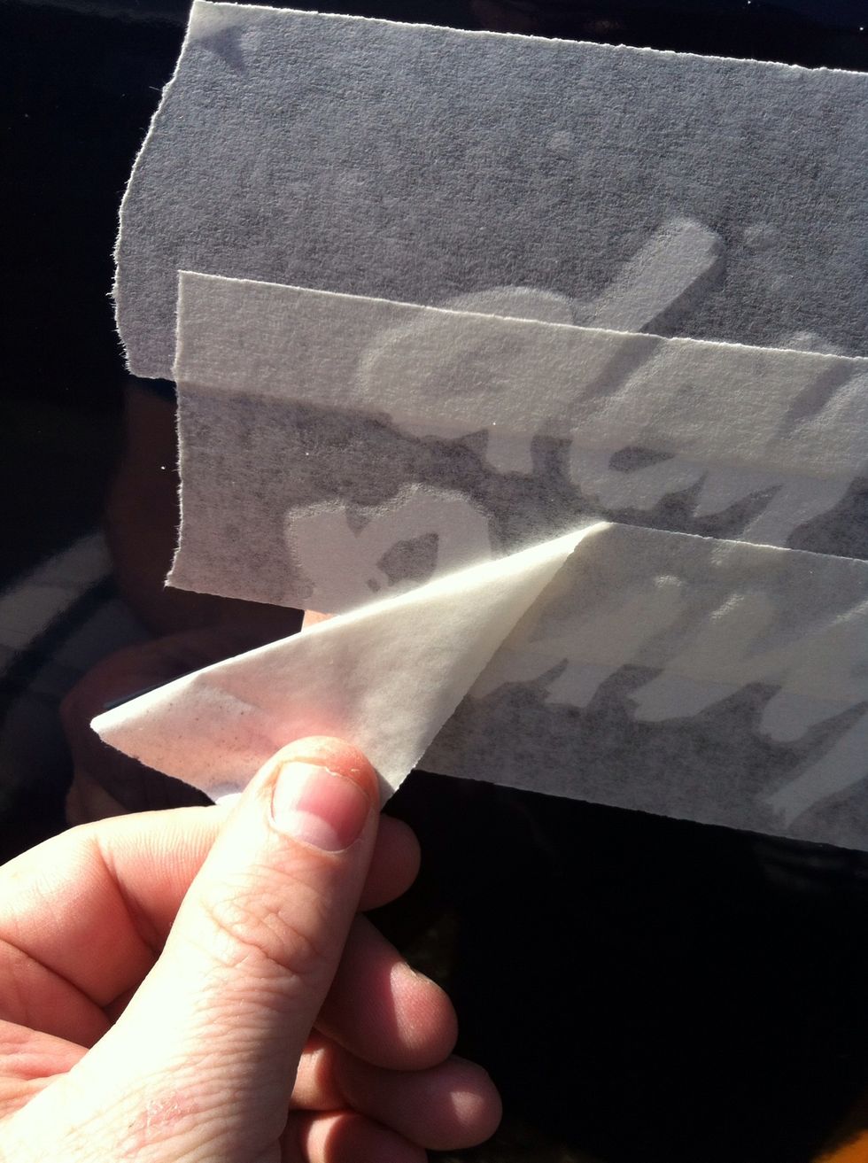 Slowly remove the application tape (this tape is in 3 parts, some decal app tape is a single piece) pulling it back on itself slowly and smoothly.