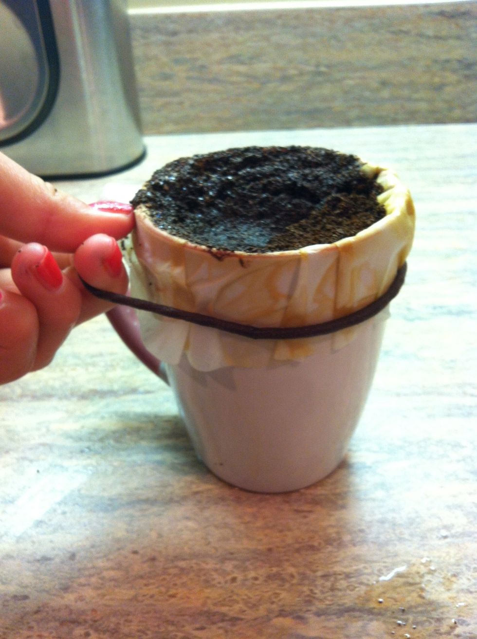 SLOWLY remove the elastic band
