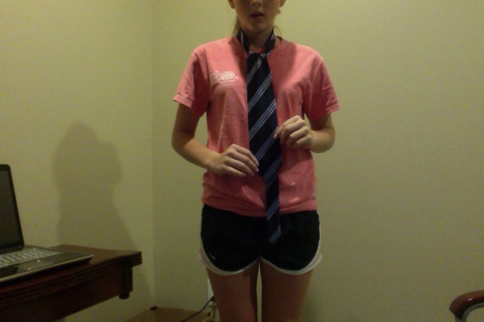 Slowly tighten the tie up to your neck and you have completed tying the tie!