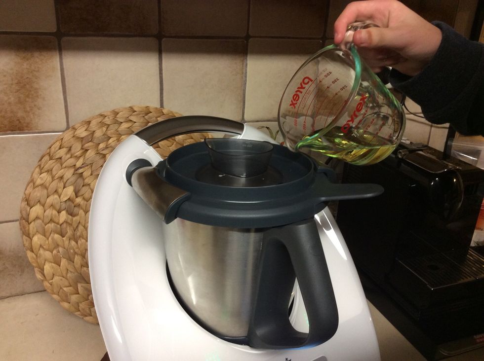 Slowly tip the grapeseed oil that was put aside for around 1 minute