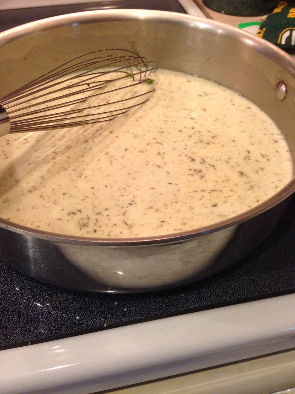 Slowly whisk in the broth, cream, and thyme and simmer until thickened, about 5 minutes.