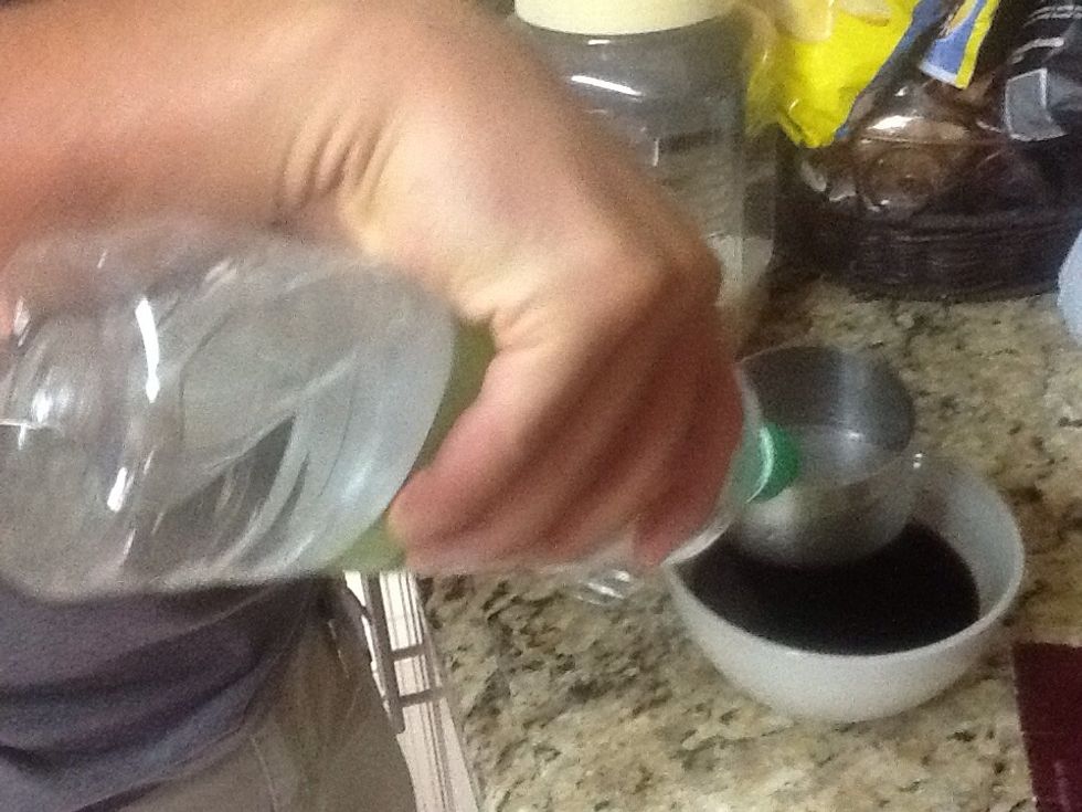 Small amount of white vinegar added to soy sauce, for later.