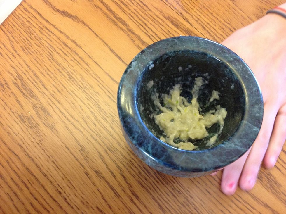 Smash 2 cloves of garlic into a paste