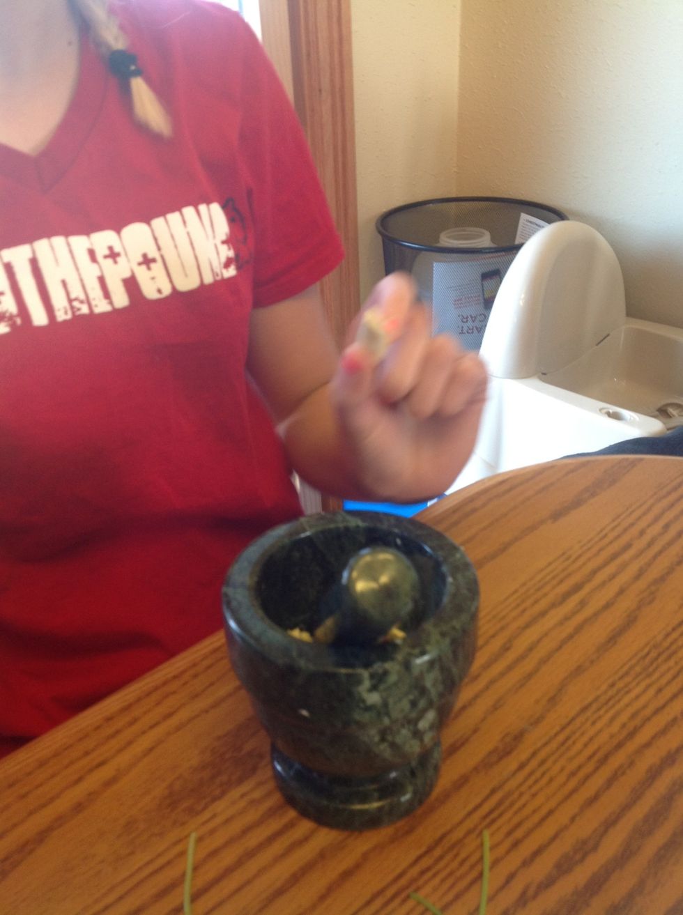 Smash 2 garlic cloves