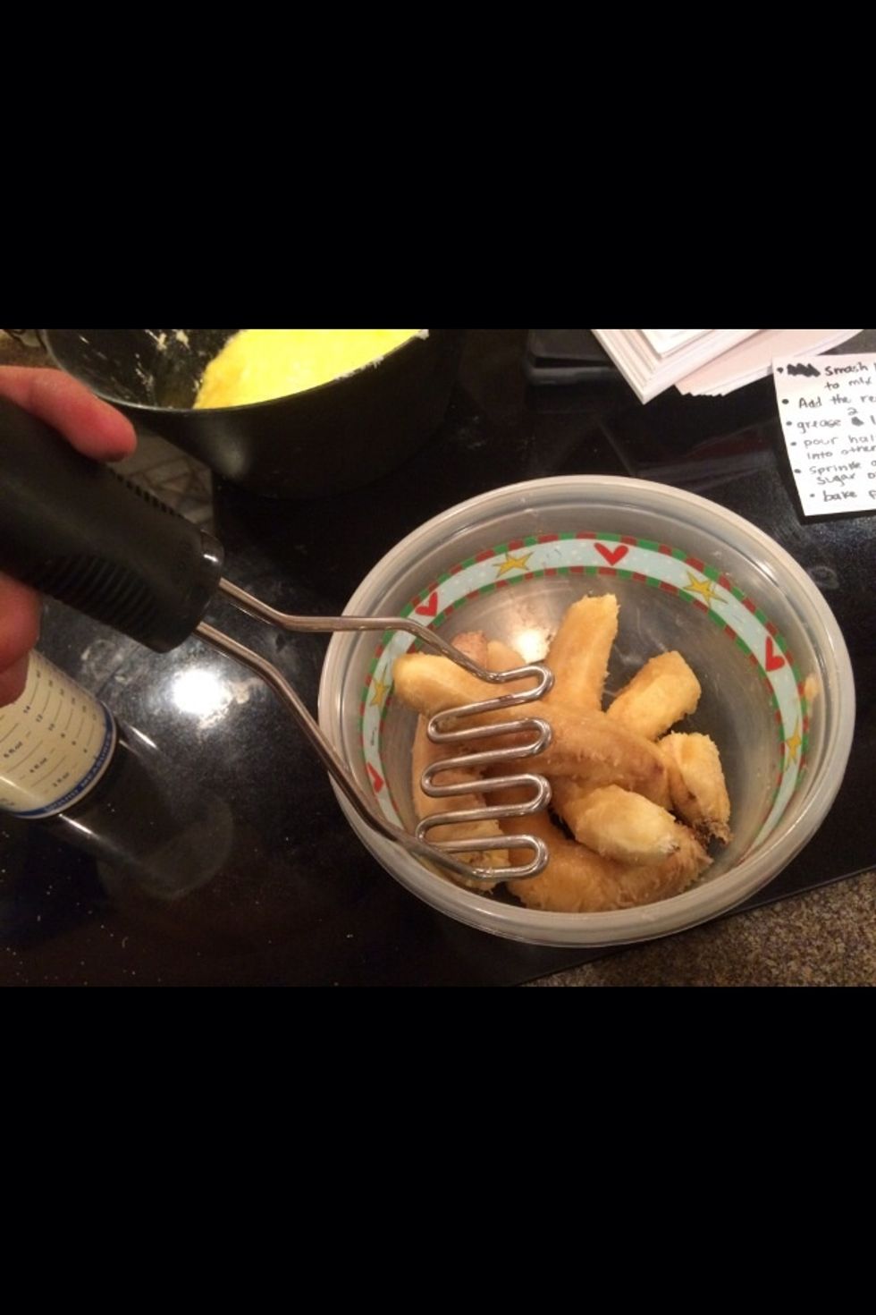 Smash 4 bananas in a seperate bowl until soft and mashed