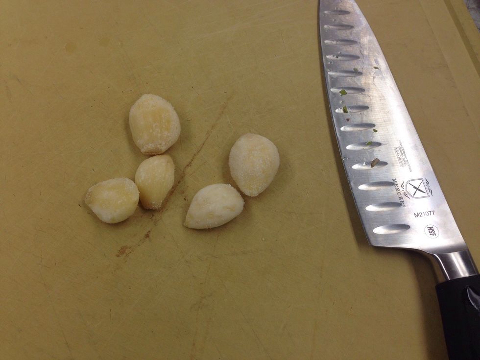 Smash each garlic clove with the blade of a knife. Combine seasonings into a small bowl.