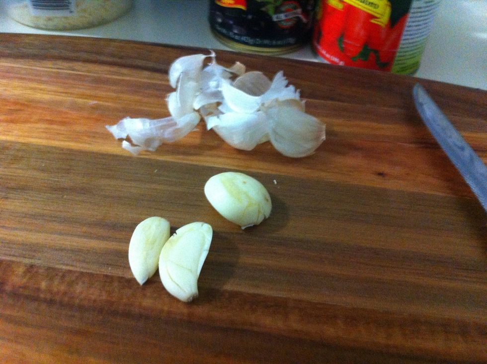 Smash garlic so the skin peels off easily
