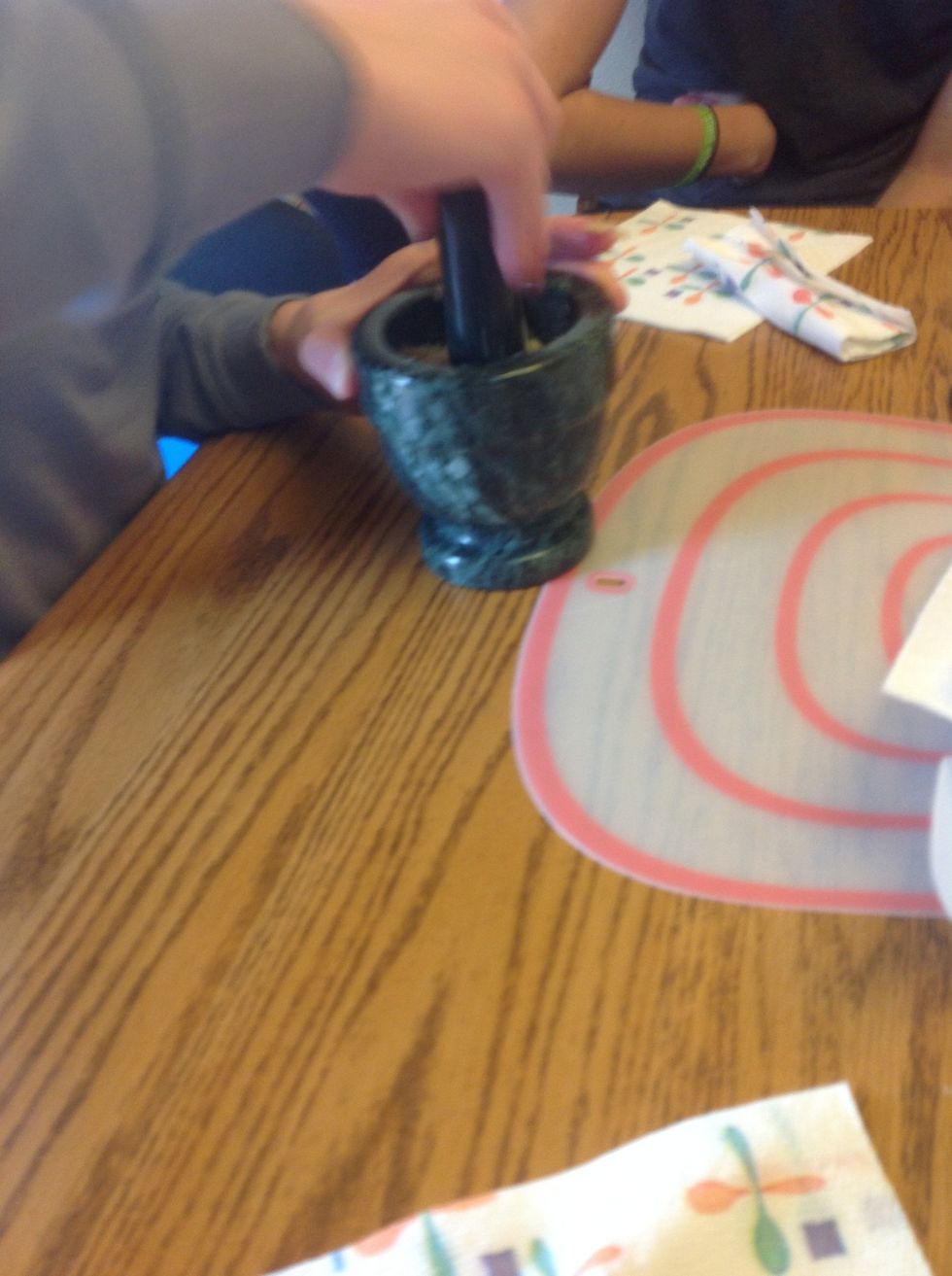 Smash garlic with some salt