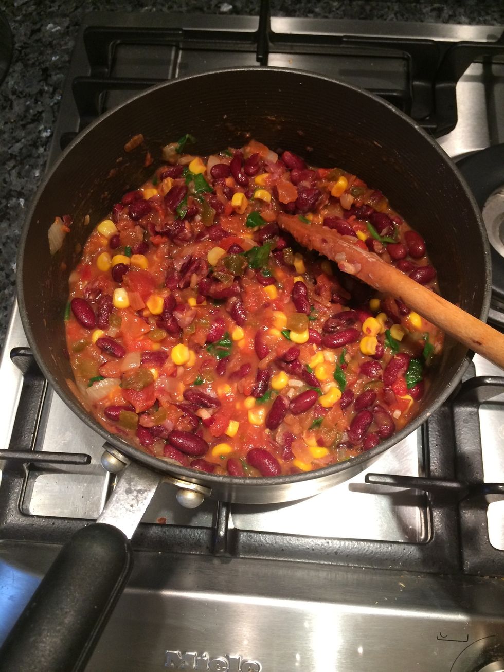 Smash kidney beans (50%). Mix in chopped spinach and El Paso chunky salsa mix & quarter cup of water. Let simmer.