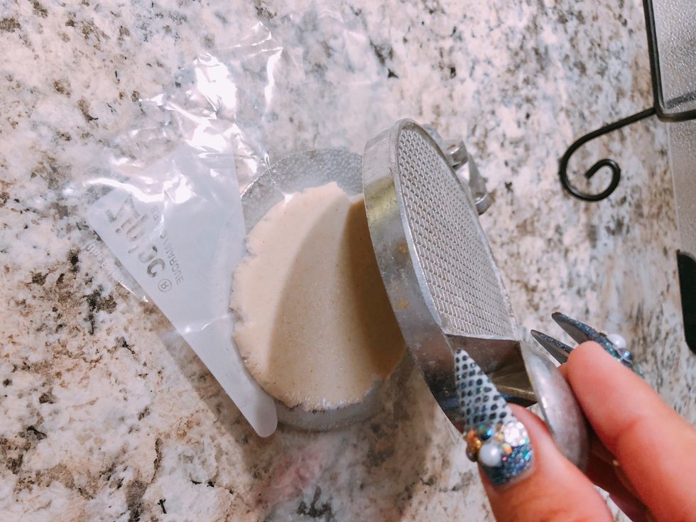 Smash kind of like a tortilla  (This device was given to me by my mom to make sopes)   *kids toy- lol*