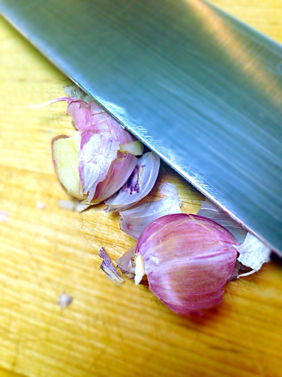 Smash the garlic. It will peal easier and will infuse the oil with more flavor while frying