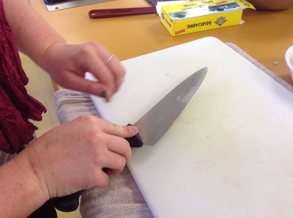 Smash the garlic to remove the peel.