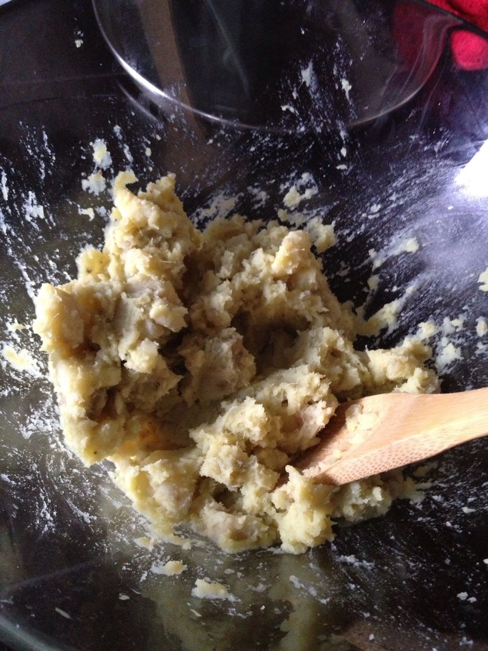 Smash the sweet potatoes and combine them with flour, sugar, and just enough water to form a smooth dough that is soft in texture but not sticky.
