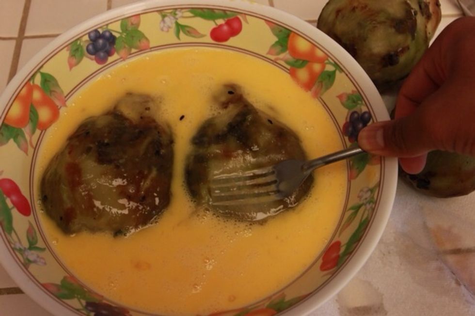 Smash your eggplants as flat as possible and then soak them in the egg mix.