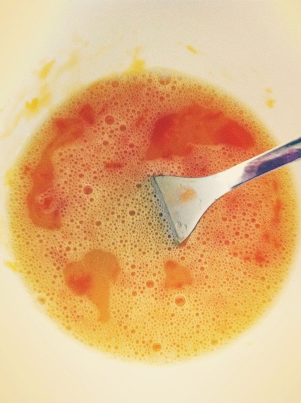 Smashed salted egg yolk & beat them together with the rest of the egg with a pinch of pepper.